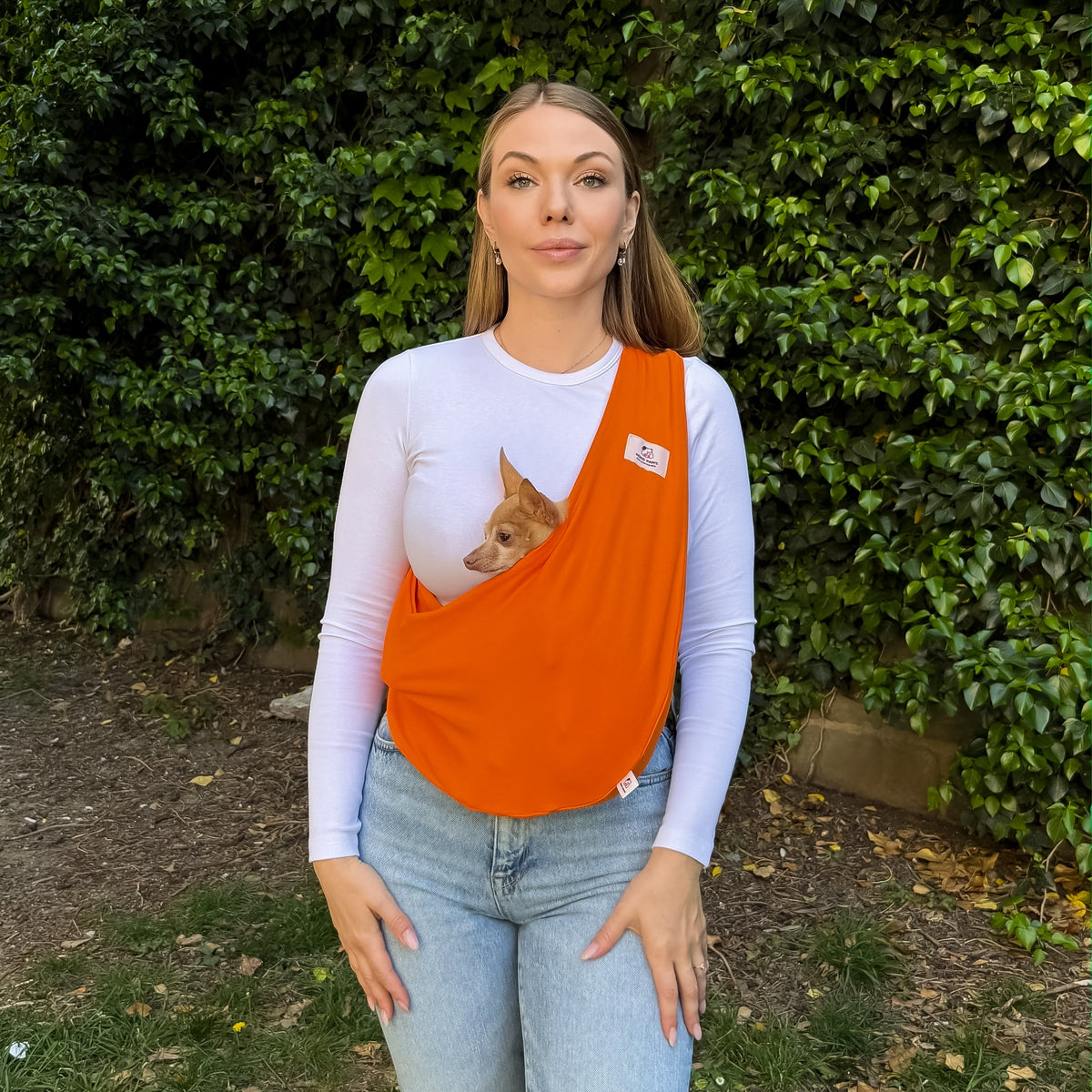 Breathable orange dog carrier sling for small dogs, soft cotton pet carrier with comfortable hands-free support