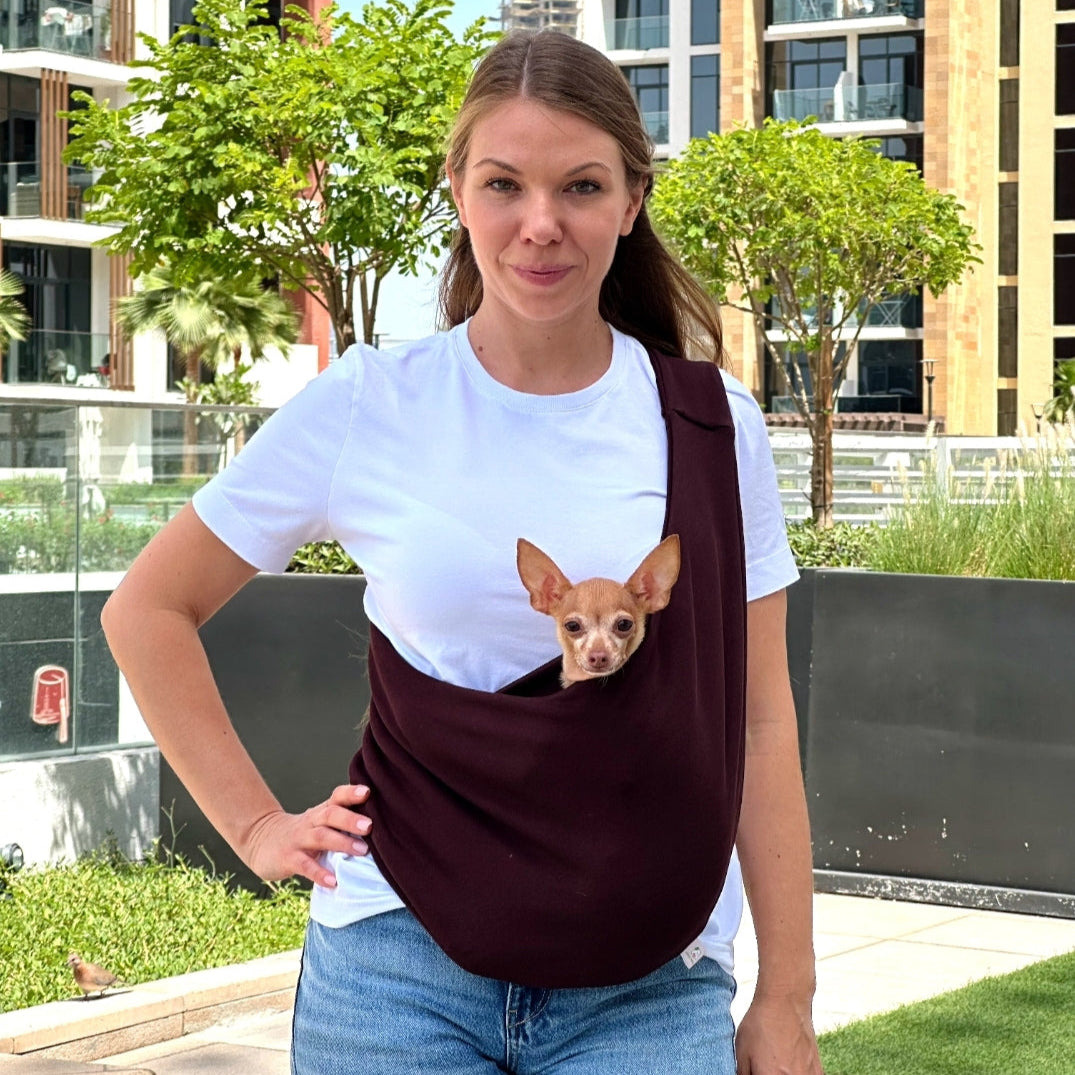 Small dog in chocolate brown cotton sling carrier – lightweight and breathable